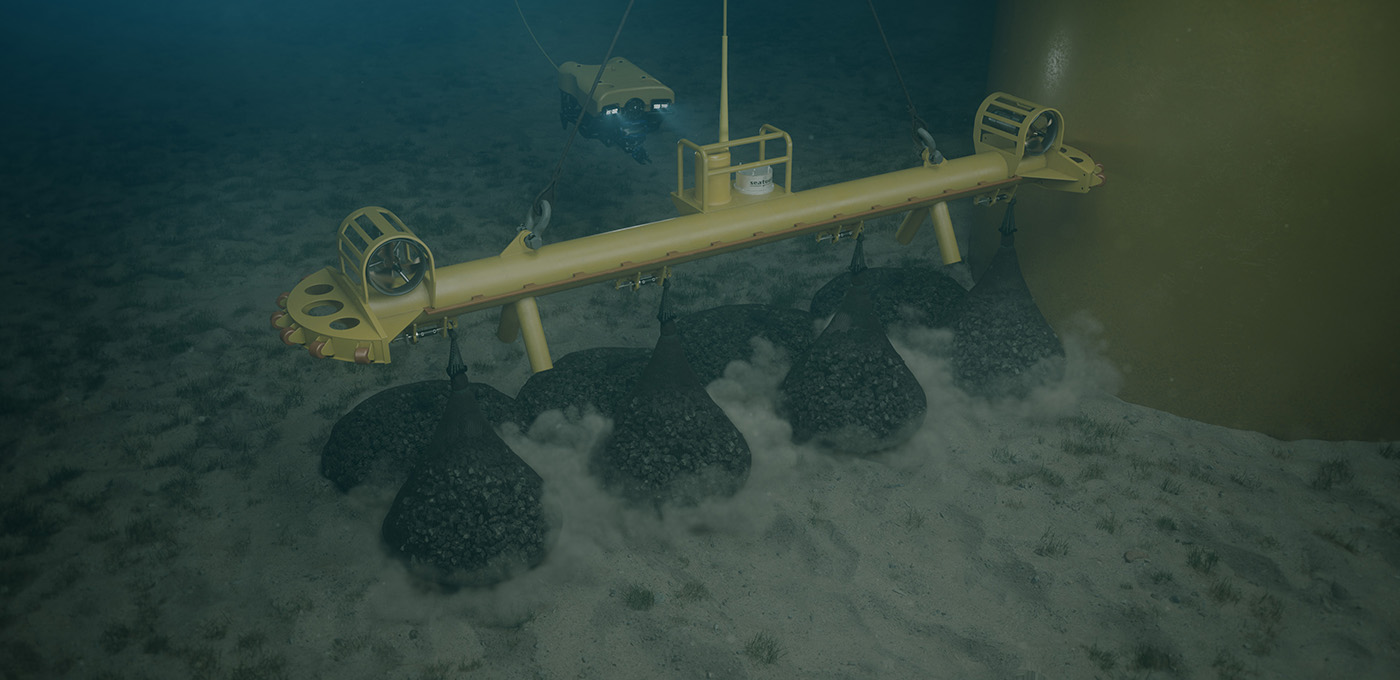 Subsea lifting beam for rock bag installation around monopiles